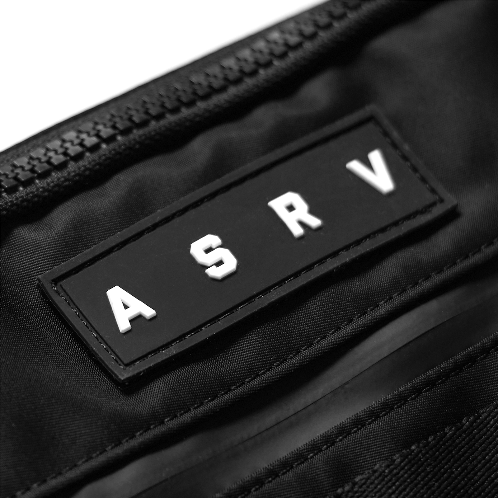 MOLLE Crossbody Bag in black, logo detail closeup