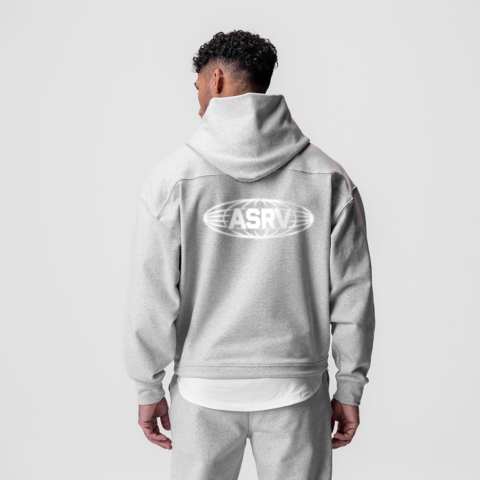 Tech-Terry Hoodie in heather grey worn by model, back view showing ASRV logo