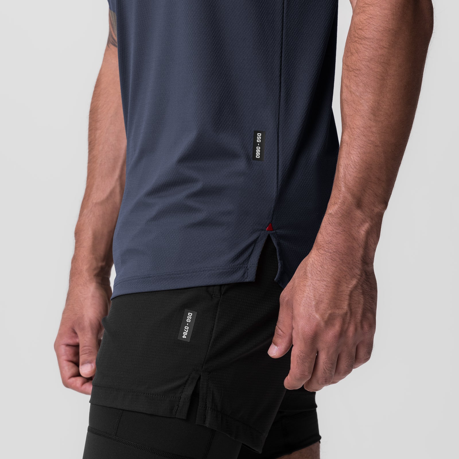 AeroSilver Established Tee in navy worn by model, side view showing fit with black shorts