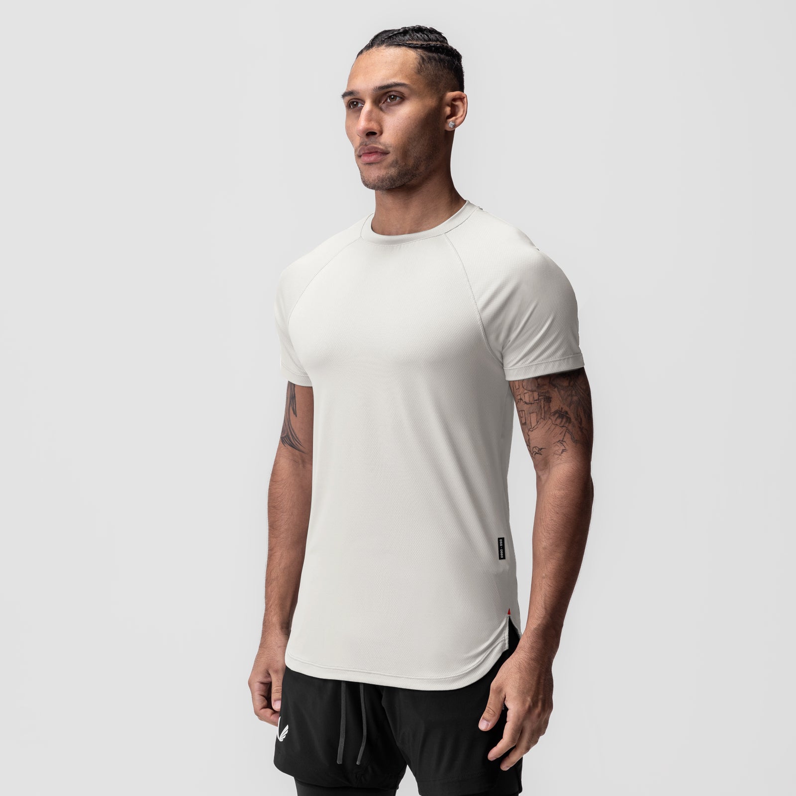 AeroSilver® Established Tee in stone, worn by model in three-quarter view