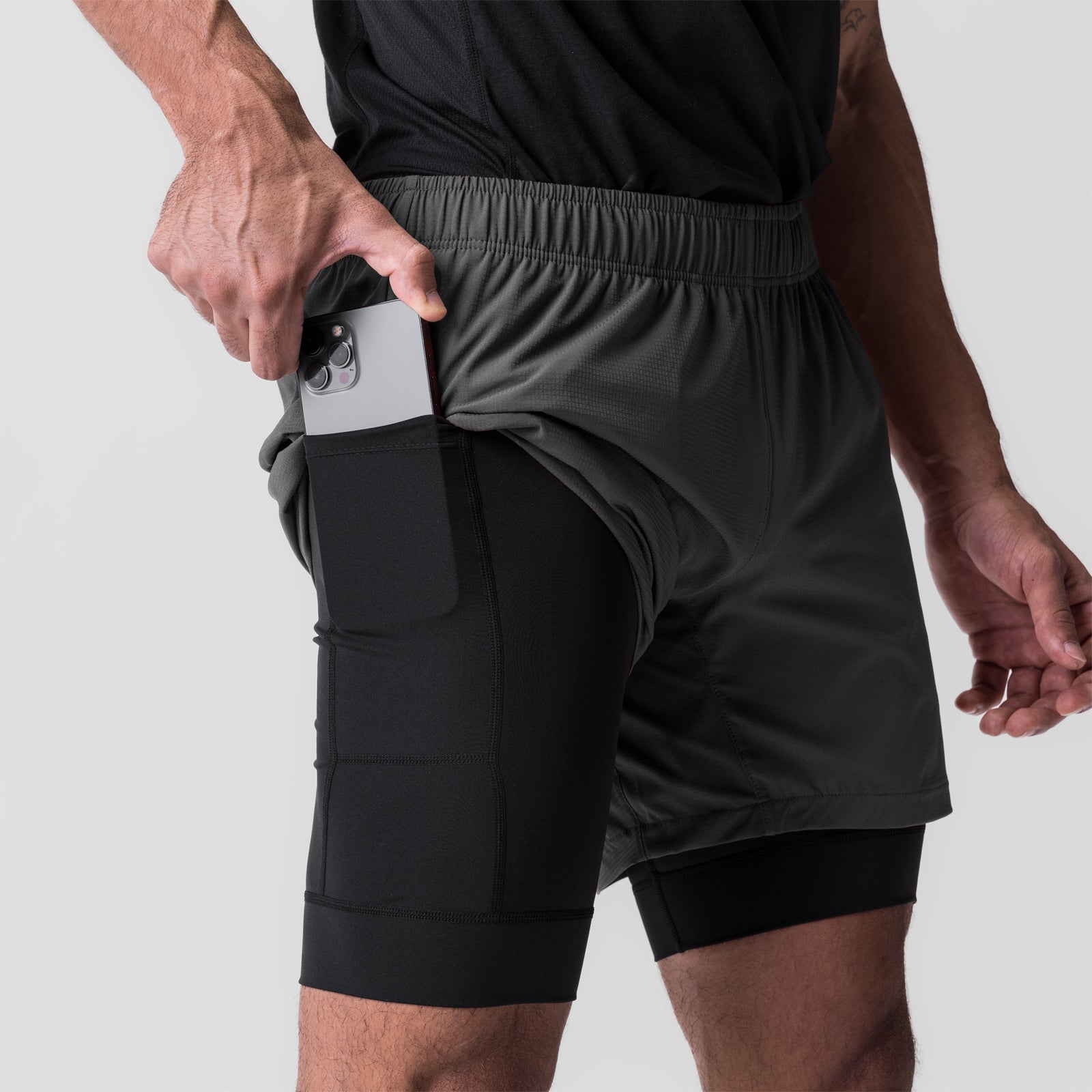 Ultralite 6" Liner Short in Raven/Black worn by model, side view showing phone pocket
