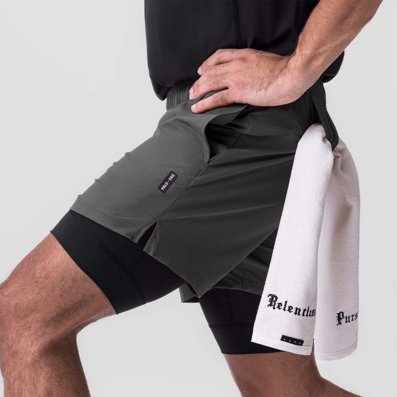 Ultralite™ 6" Liner Short in Raven/Black worn by model, holding white towel