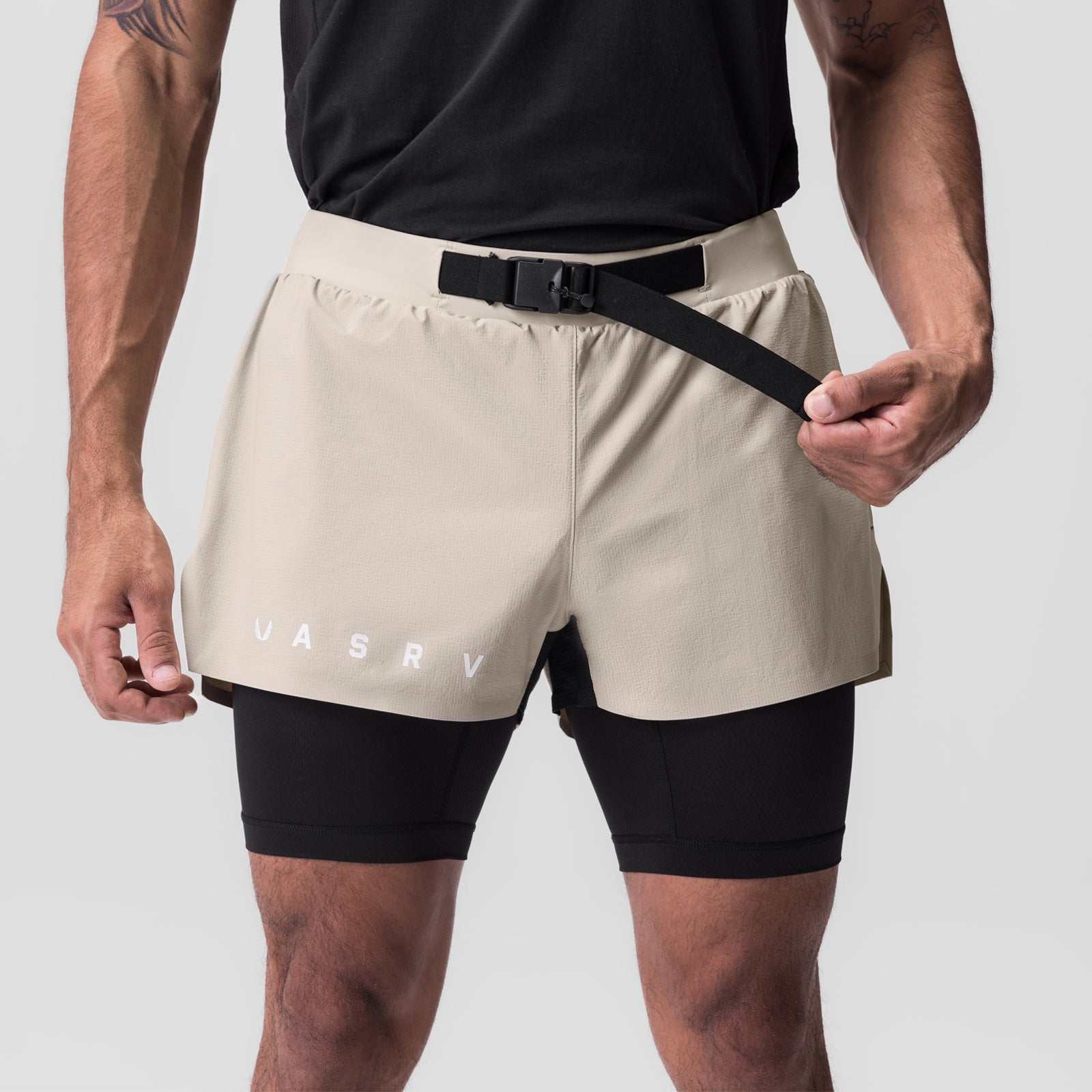 Ripstop 3" Belt Pack Short in beige and black worn by model, front view