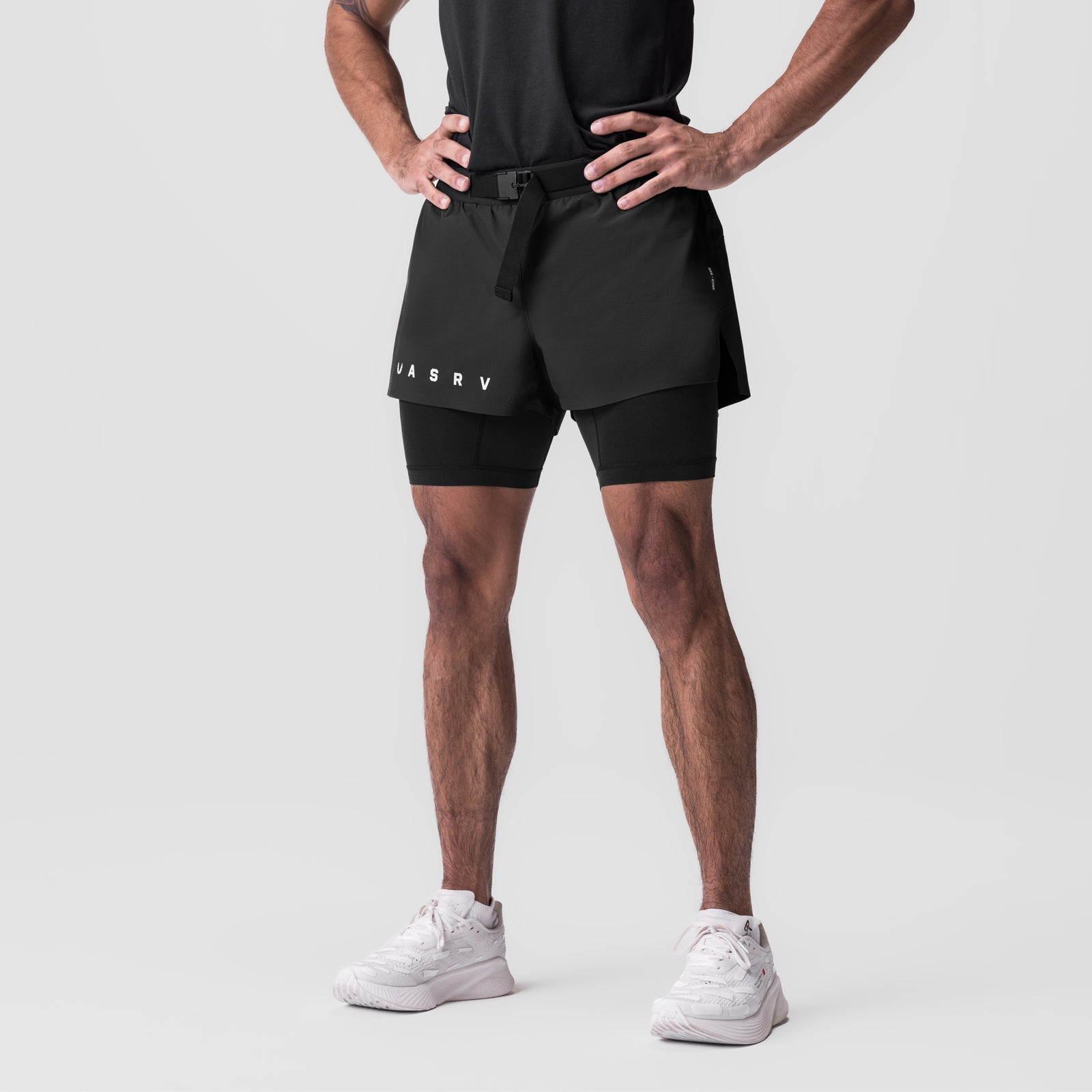 Ripstop 3" Belt Pack Short in black worn by male model with white sneakers, front view
