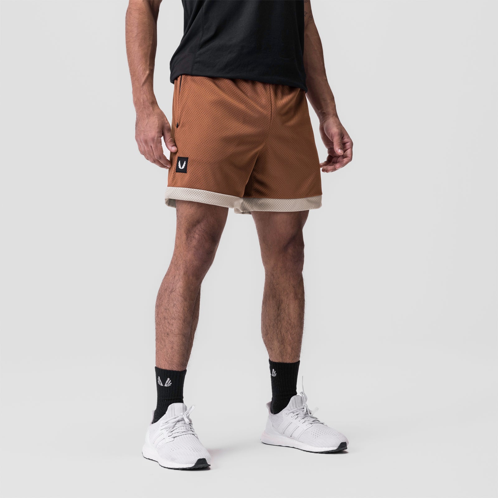 SilverPlus™ Mesh Reversible Short in Rust/Beige worn by model, front view