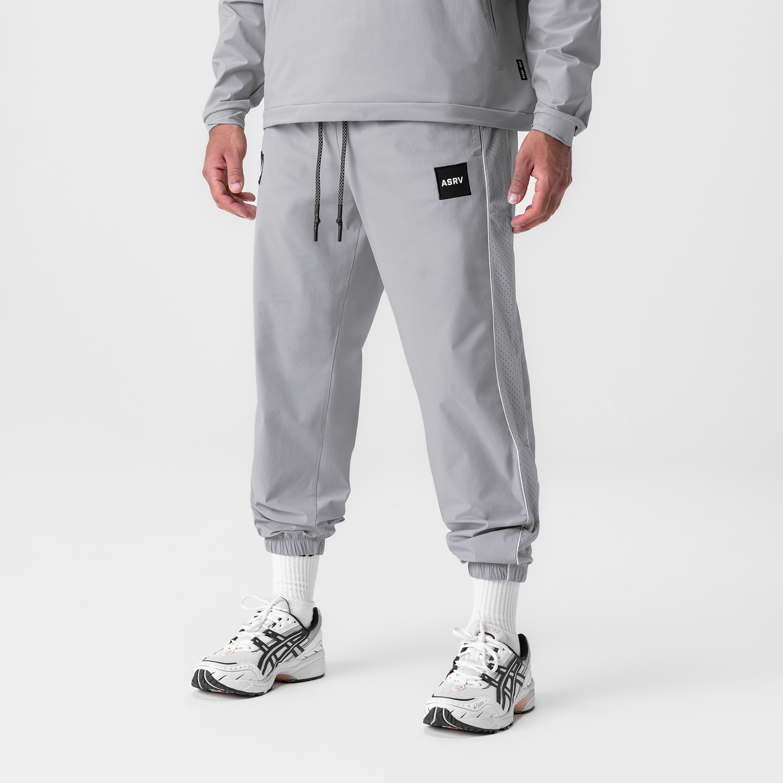 Ripstop Oversized Track Pant in slate grey worn with white sneakers, front view