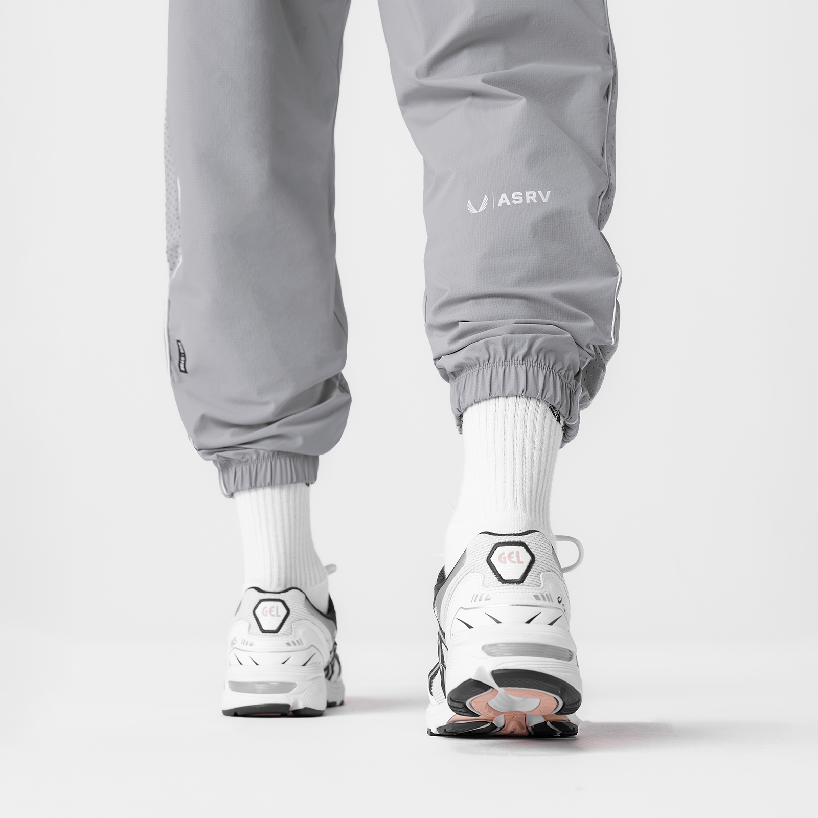 Ripstop Oversized Track Pant in slate grey worn with white socks and sneakers, back view