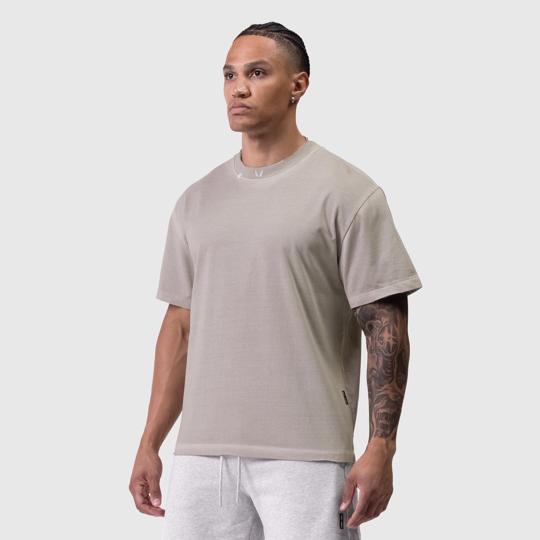 Tech Essential Relaxed Tee in Faded Chai, modeled from side angle
