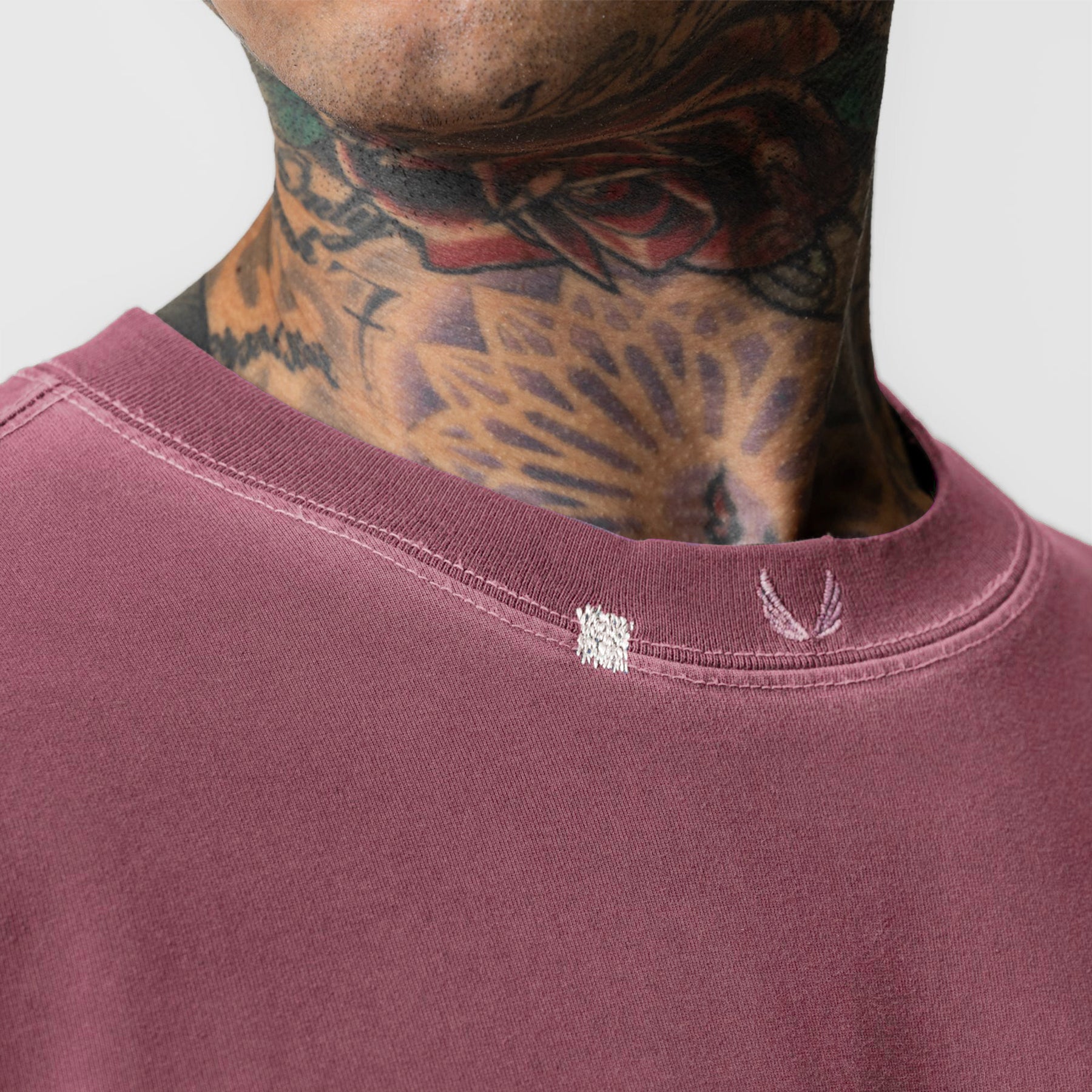 Tech Essential Relaxed Tee in Faded Crimson worn by model, neck detail view
