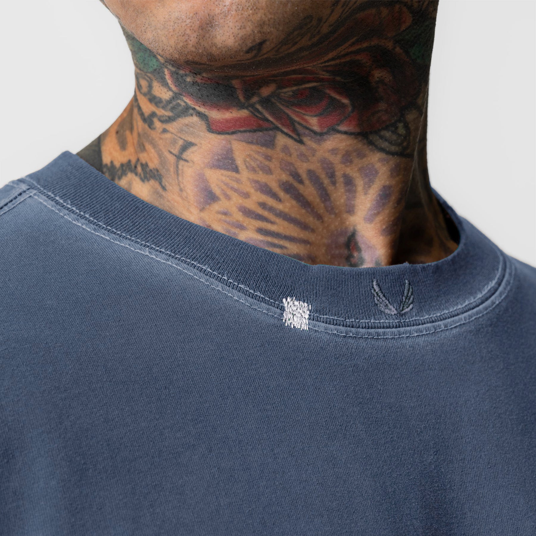 Tech Essential Relaxed Tee in Faded Navy worn by model, neckline detail view