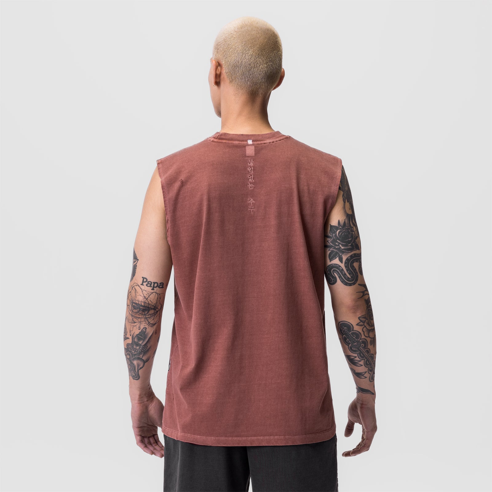 Tech Essential Relaxed Cutoff tank in faded brick, back view on model