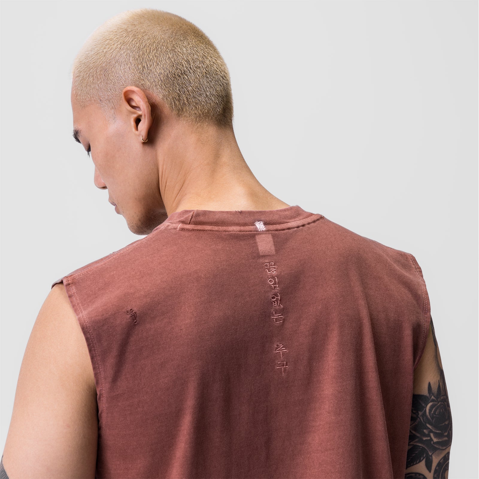 Tech Essential Relaxed Cutoff in faded brick, model wearing sleeveless tee, back view
