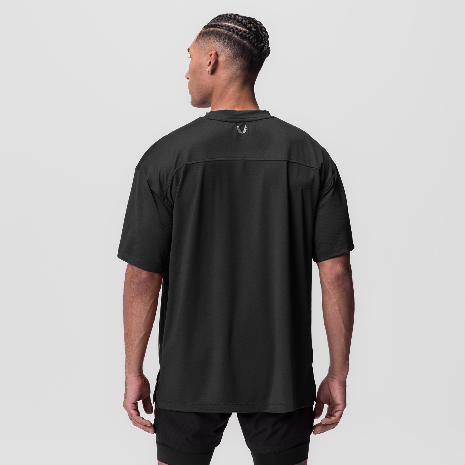 AeroSilver Oversized Tee in black worn by model, back view