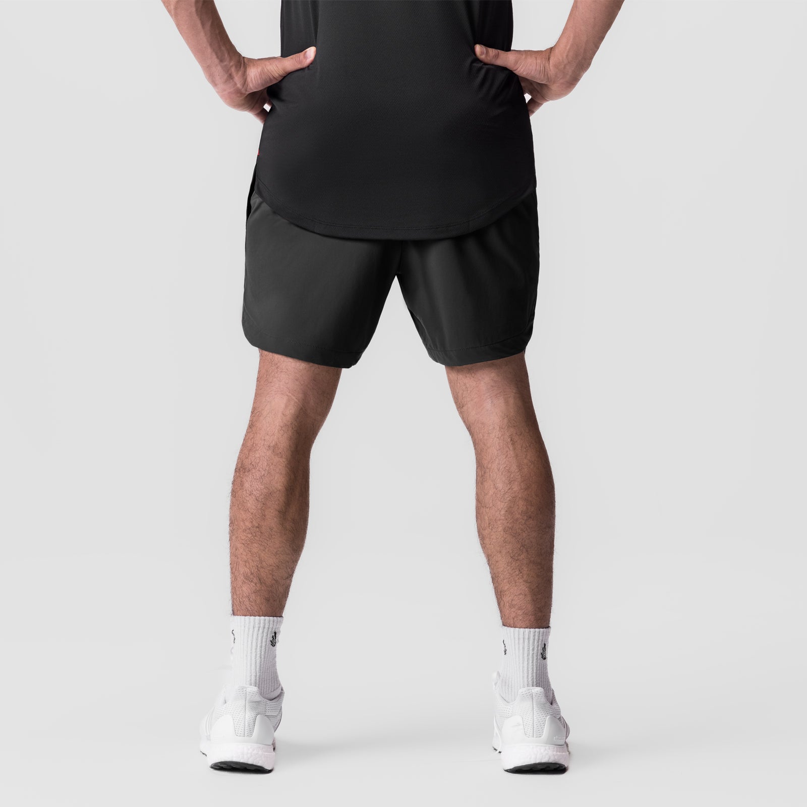 Black Tetra-Lite 7" linerless shorts worn by model, front view