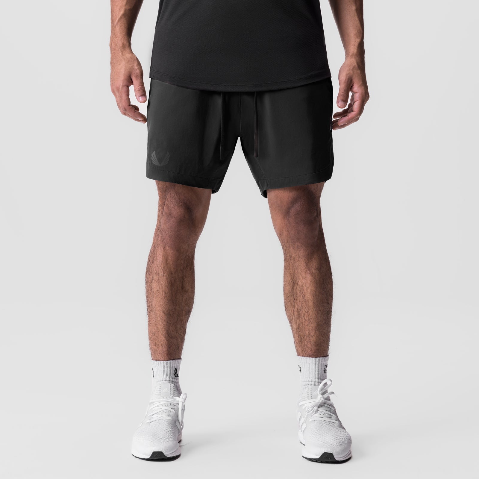 Black Tetra-Lite 7" linerless shorts on model, front view