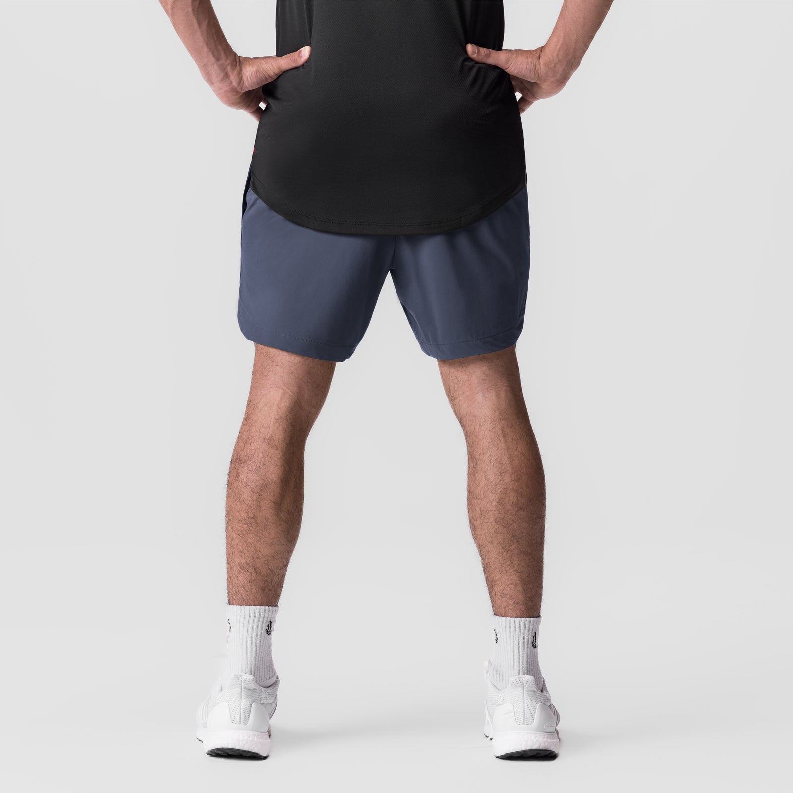 Tetra-Lite 7" Linerless Short in navy, modeled from front with hands on hips