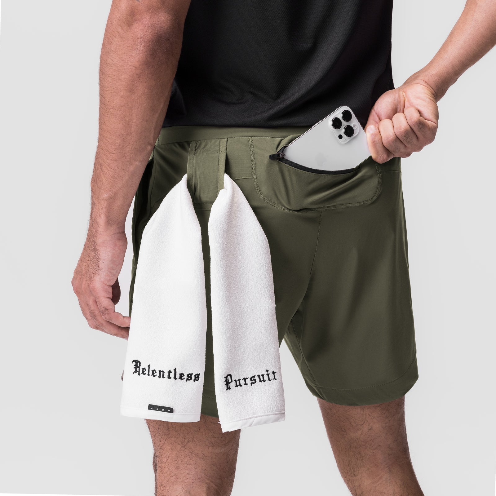 Tetra-Lite 7" Linerless Short in olive, modeled with white towel and phone in pocket