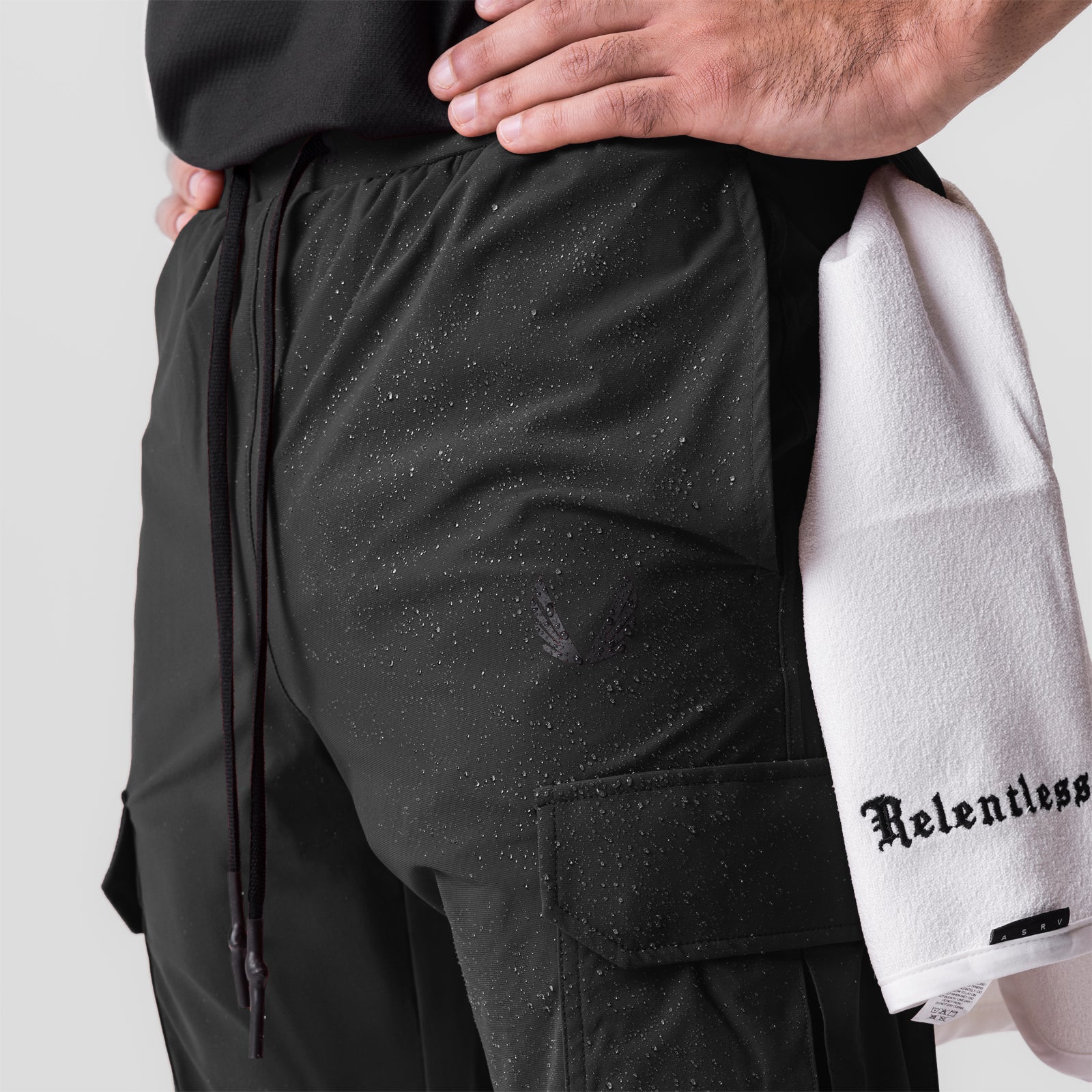 Tetra-Lite® Cargo High Rib Jogger in black worn by model, side view detail