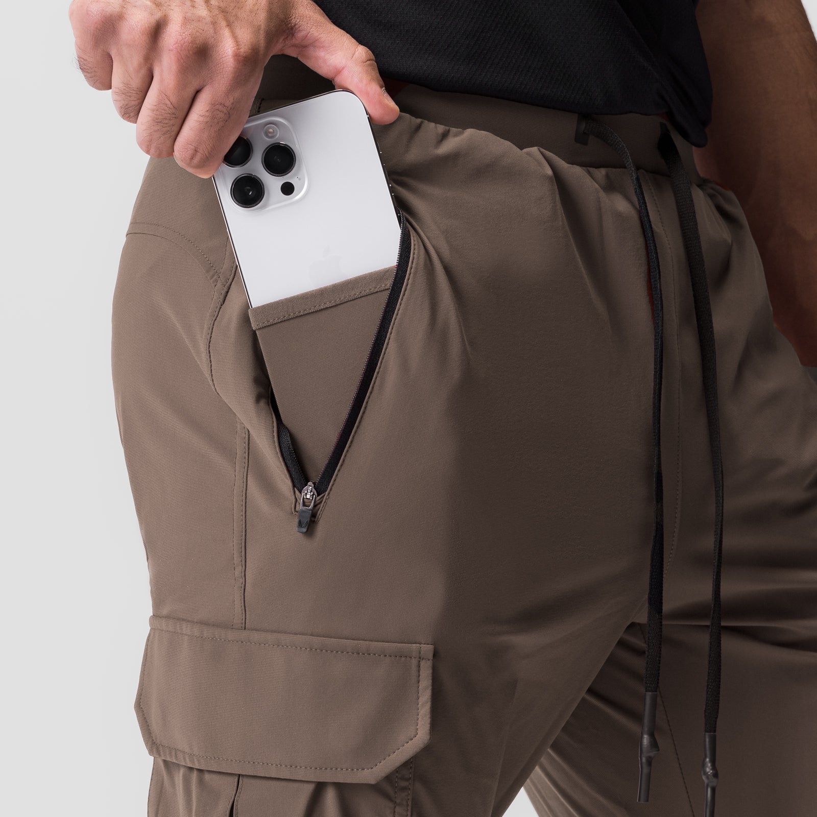 Tetra-Lite Cargo High Rib Jogger in deep taupe, worn with phone in cargo pocket