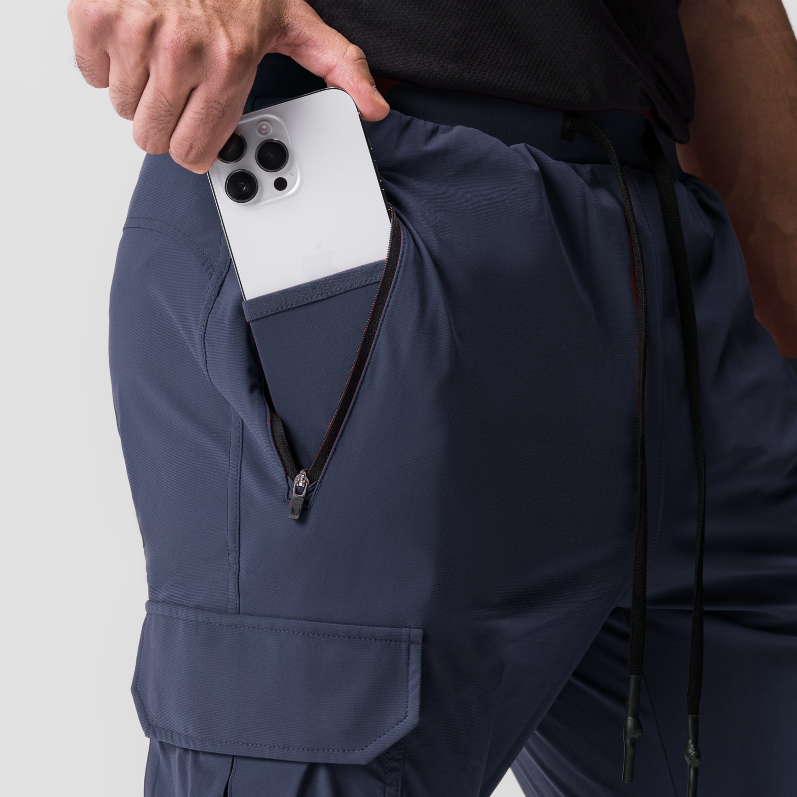 Tetra-Lite Cargo High Rib Jogger in navy being worn, shown from waist down with phone in pocket