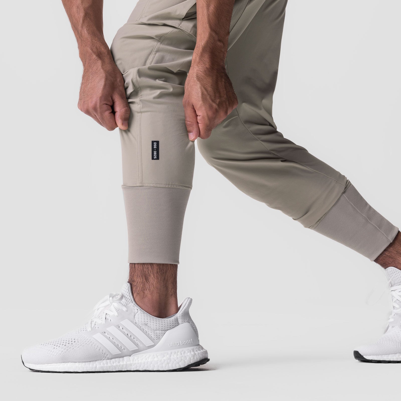 Tetra-Lite Cargo High Rib Jogger in Sand Smoke worn by model, side view