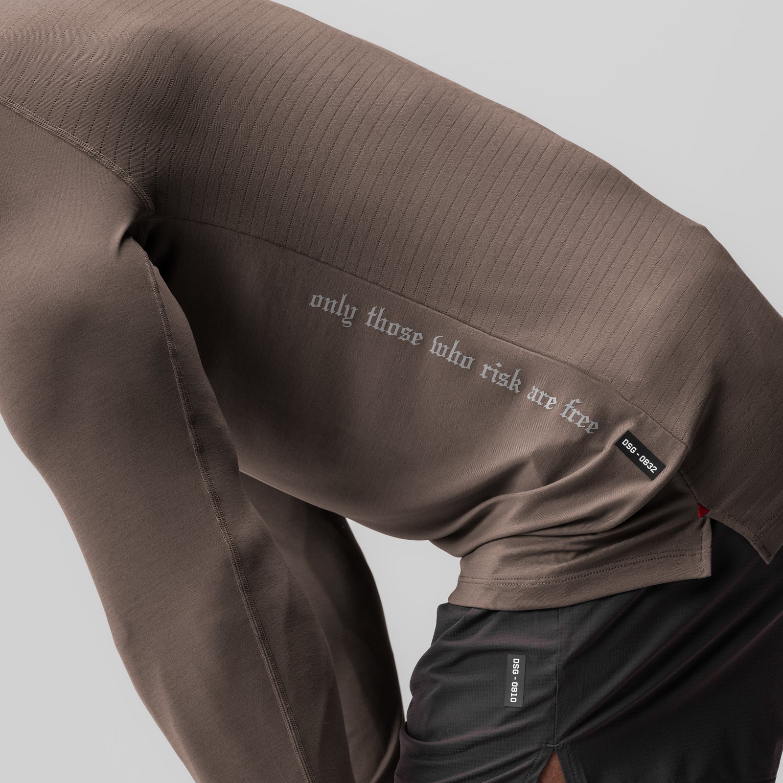 3D-Lite® 2.0 Fitted Long Sleeve in deep taupe worn with black joggers, detail of back text
