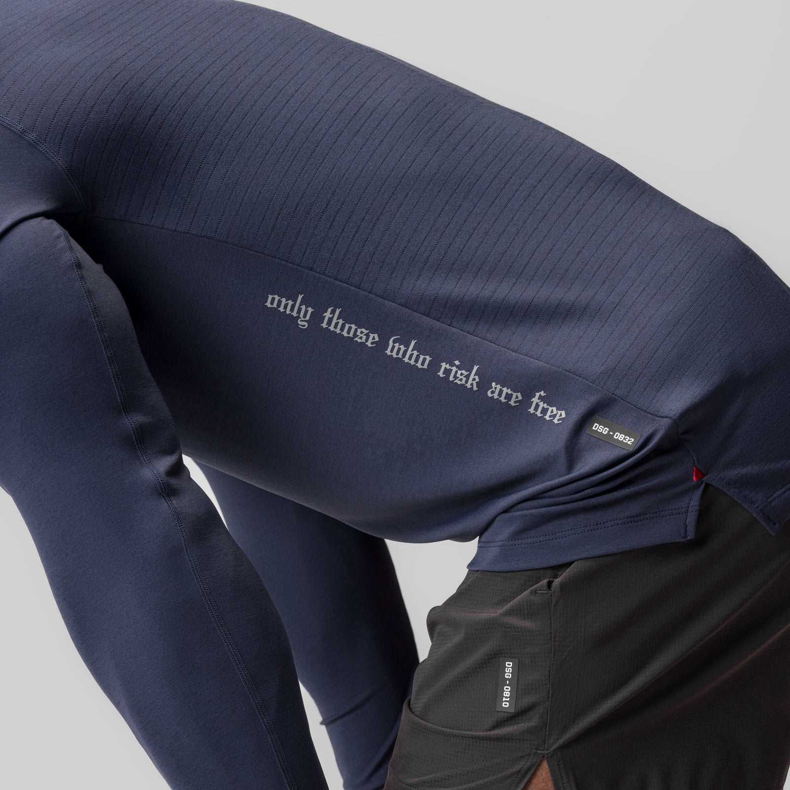 0832. 3D-Lite® 2.0 Fitted Long Sleeve in navy worn by model, detail view of text on sleeve
