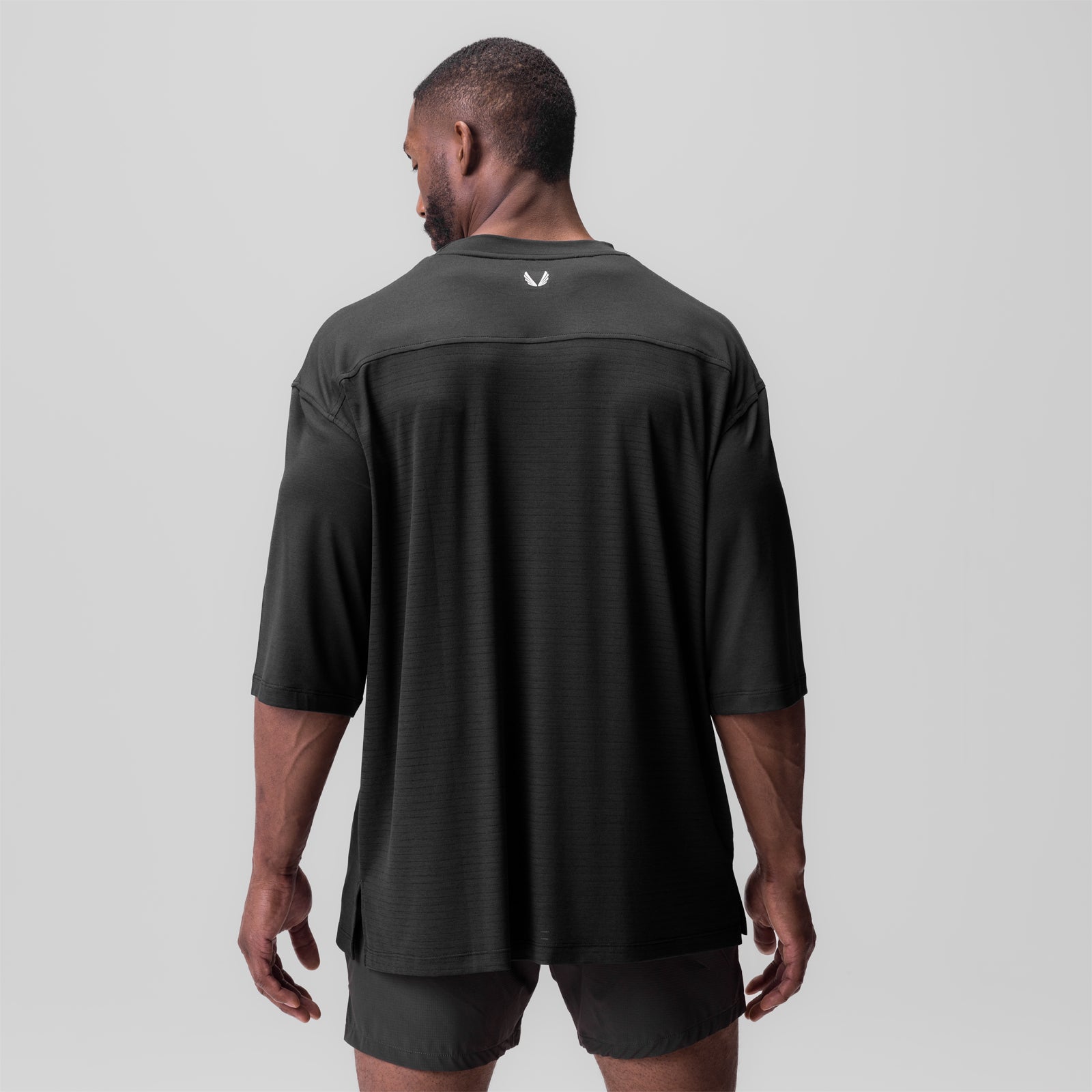 Black 3D-Lite 2.0 3/4-sleeve oversized tee worn by model, back view