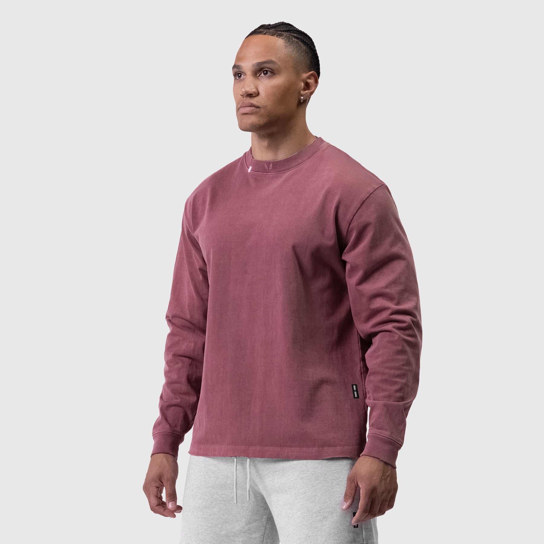 Tech Essential Relaxed Long Sleeve in faded crimson, worn by model in three-quarter view