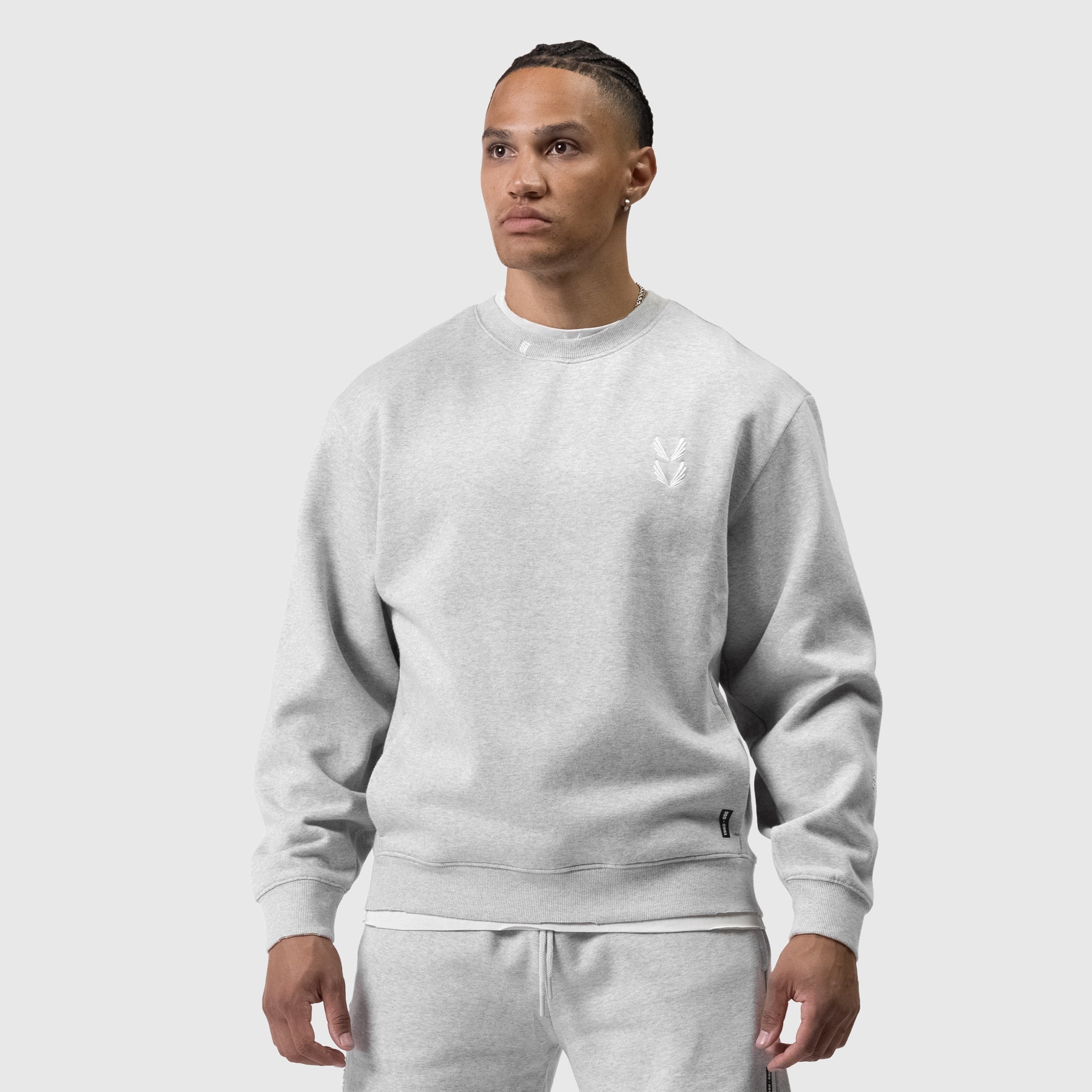 Tech Essential Distressed Crewneck in heather grey, worn by model, front view