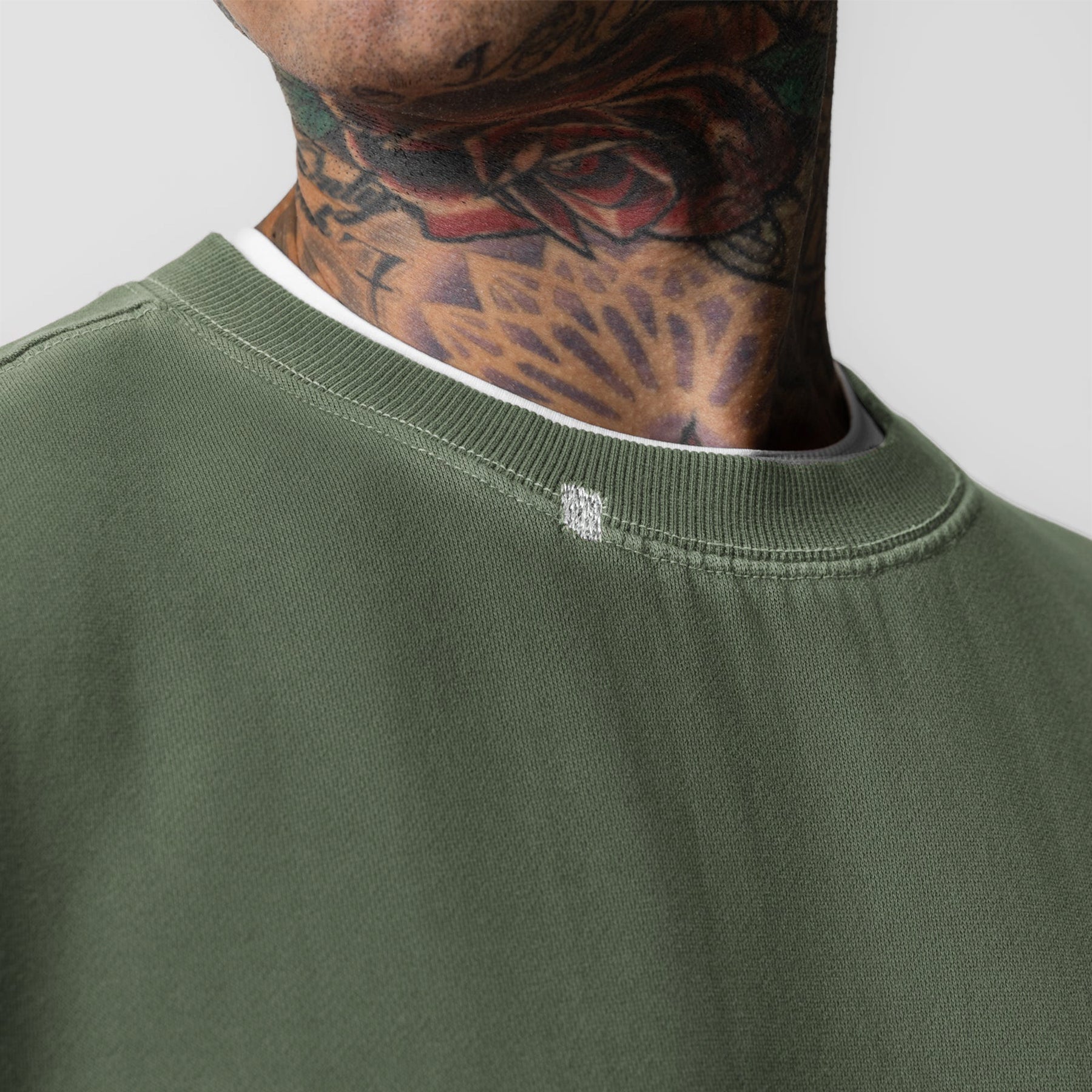 Tech Essential Distressed Crewneck in Faded Olive worn by model, neck detail view