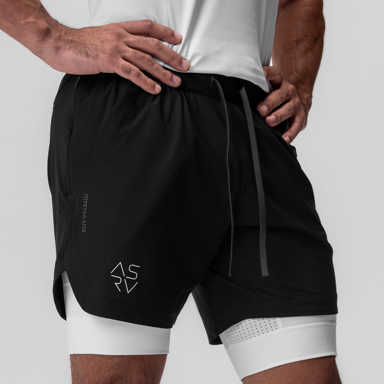Tetra-Lite 7" Liner Short in black with white underlay, worn by model from waist down