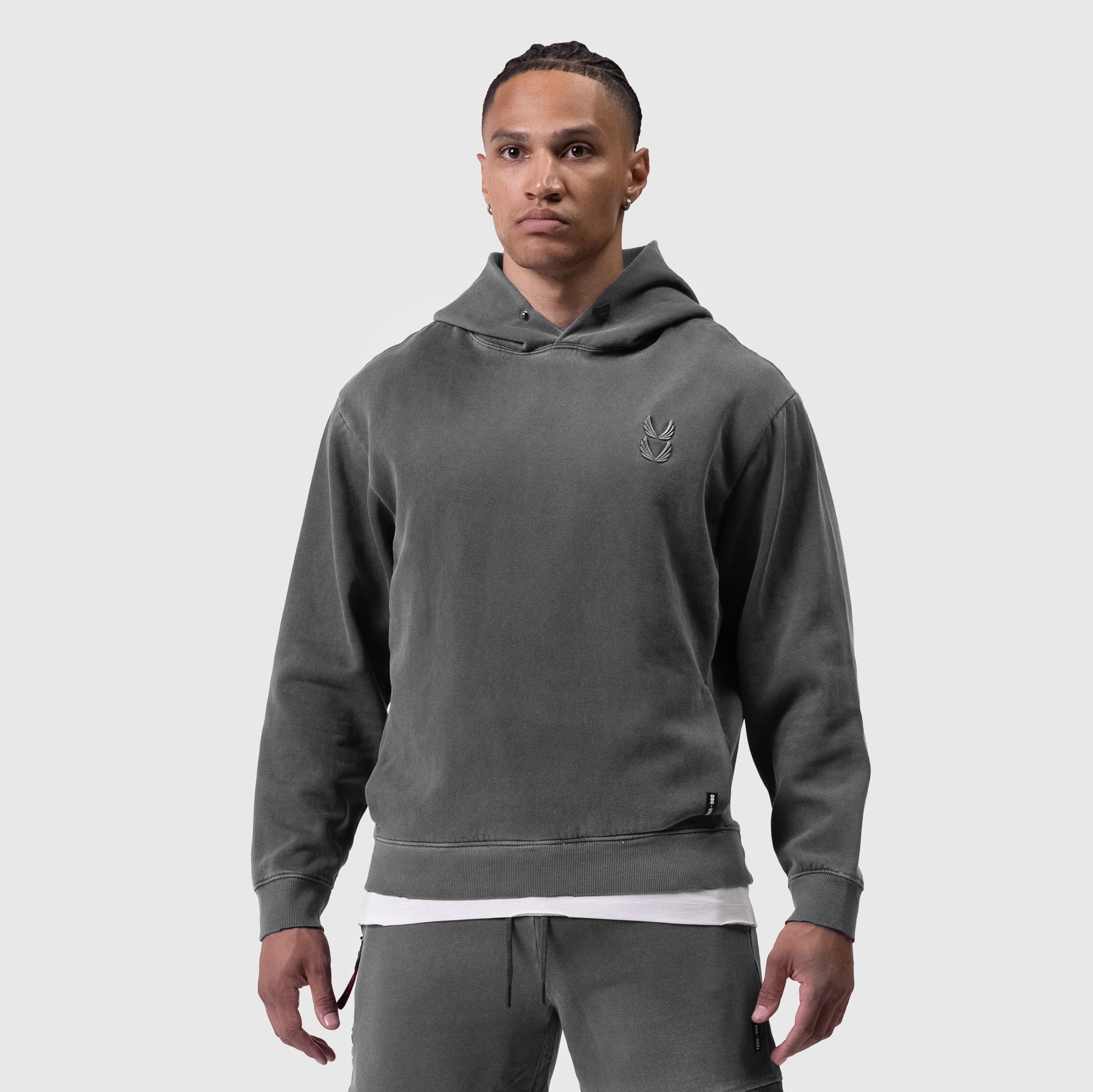 Tech Essential Distressed Hoodie in faded grey worn by male model, front view