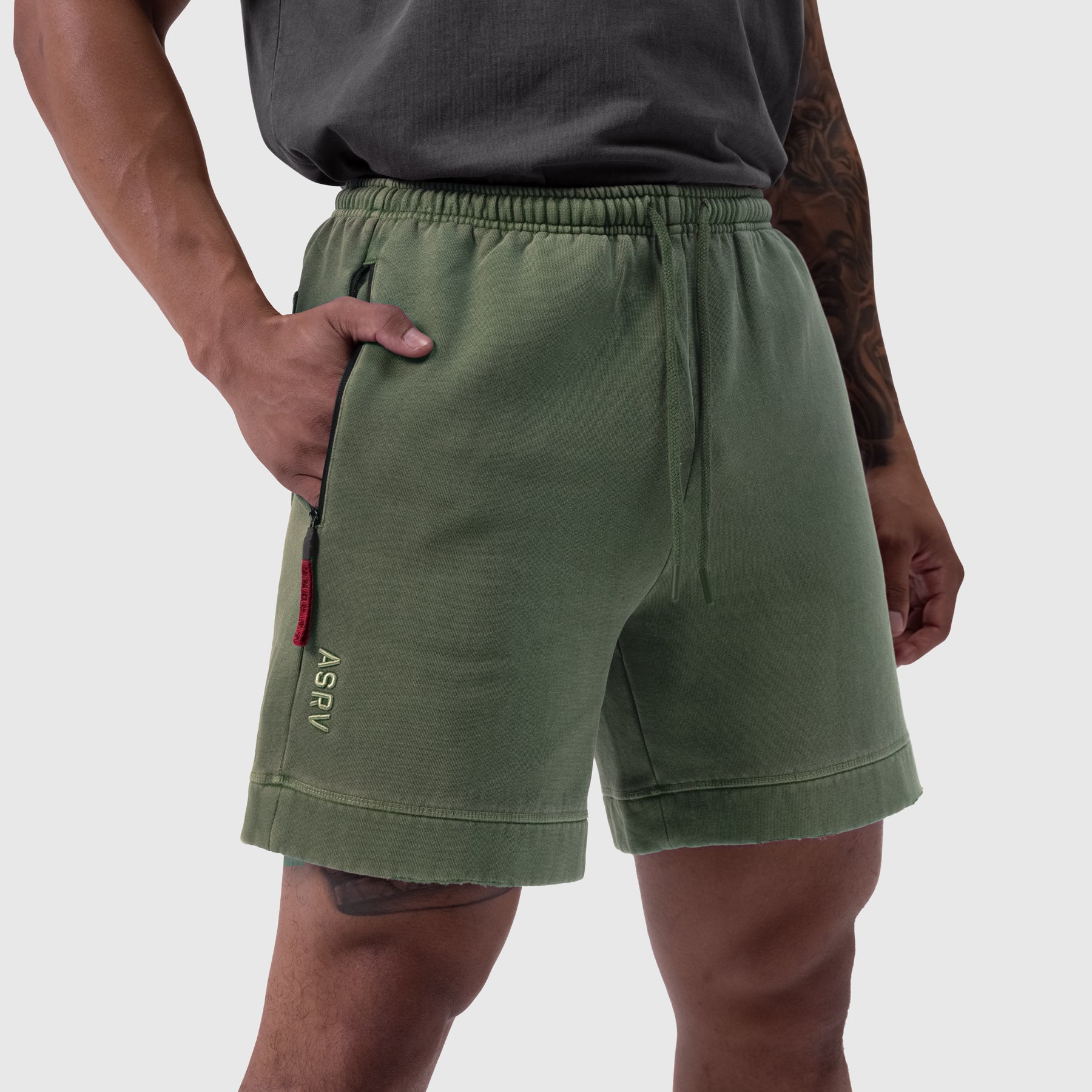 Tech Essential Sweat Short in Faded Olive worn by model, side view