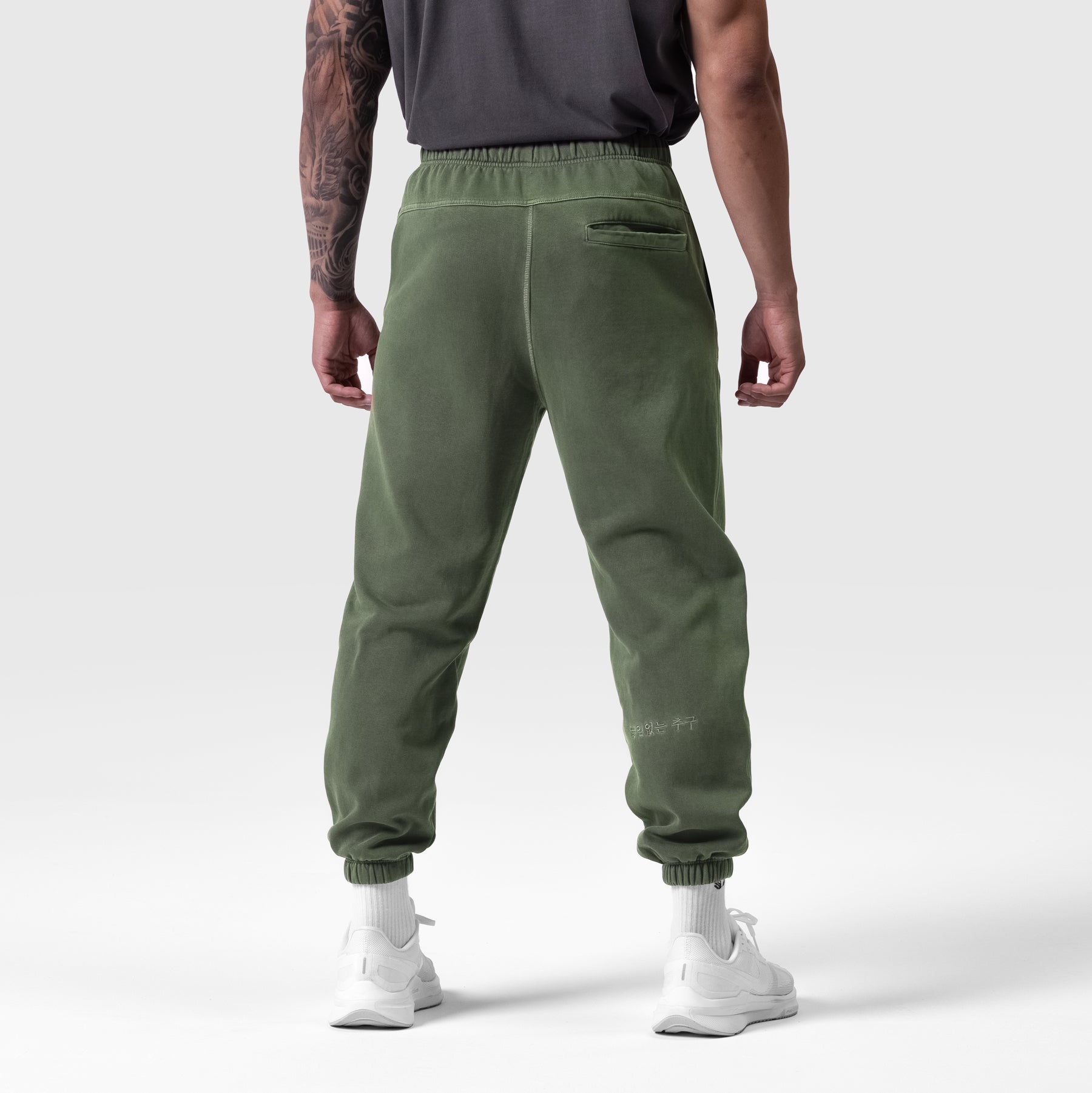 Tech Essential Sweats in faded olive worn by model, back view