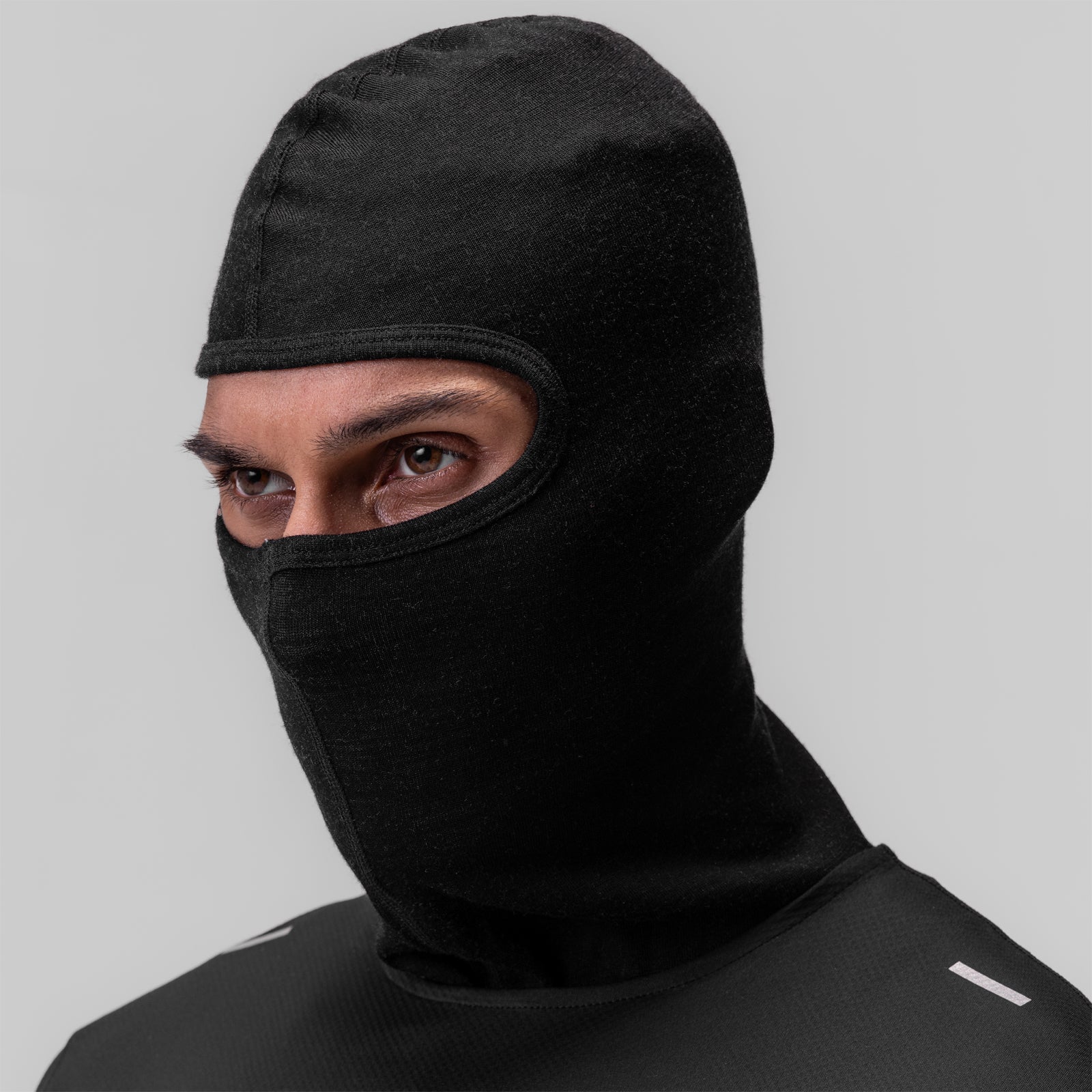 Merino Wool Balaclava in black, worn by model showing front view