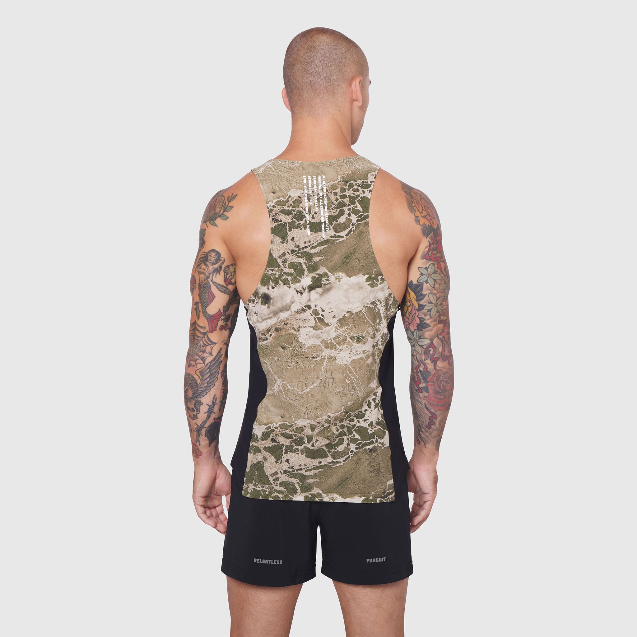 Laser-Vent Singlet Tank in camo print, worn by model from back view