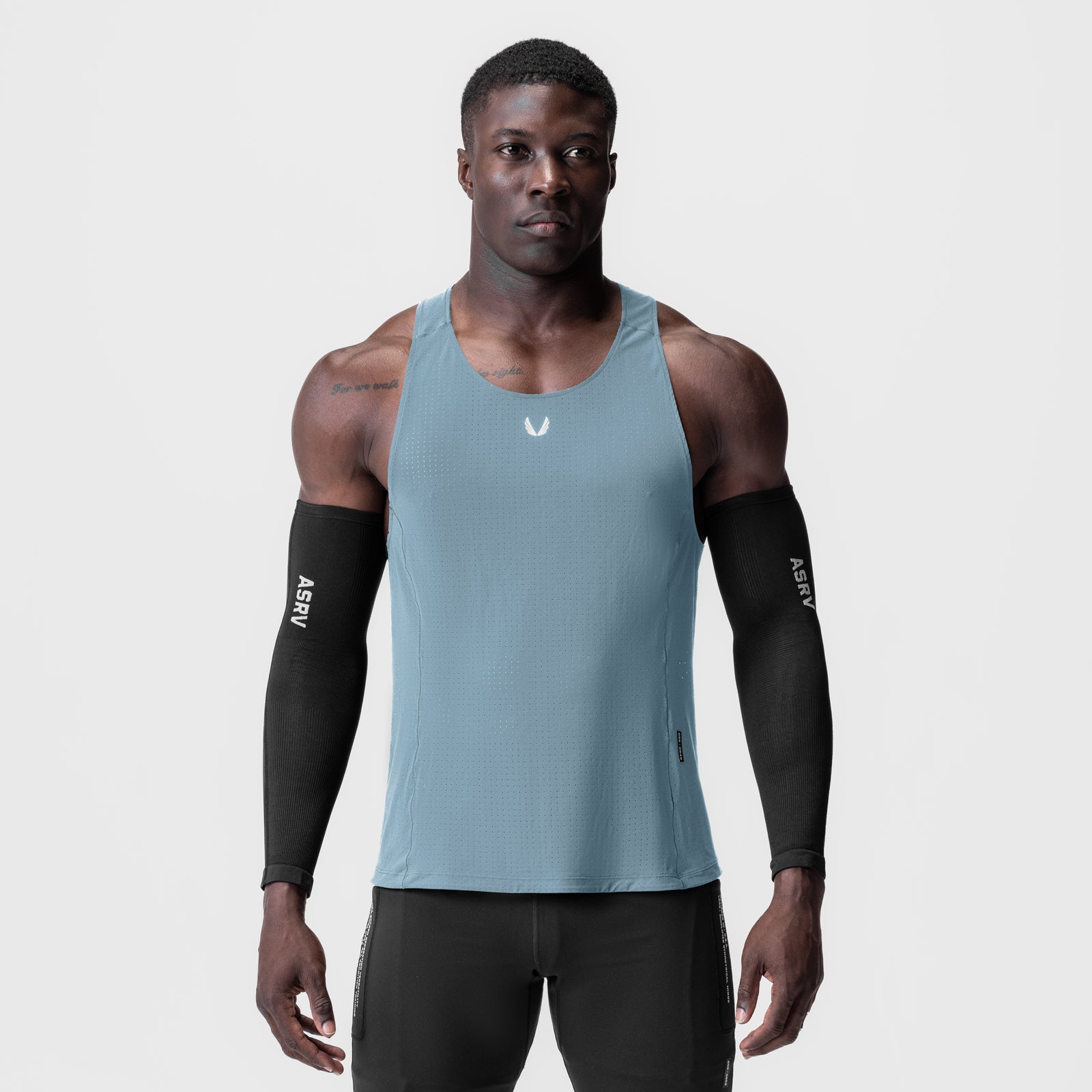 Laser-Vent™ Singlet Tank in light sky worn with black arm sleeves, front view