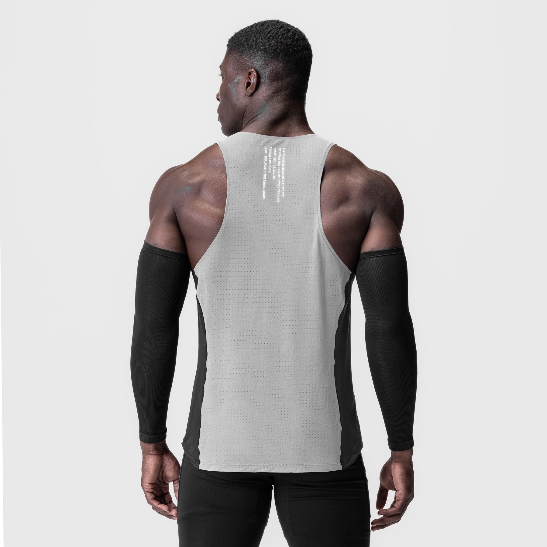 Laser-Vent™ Singlet Tank in slate grey and black worn by model, back view