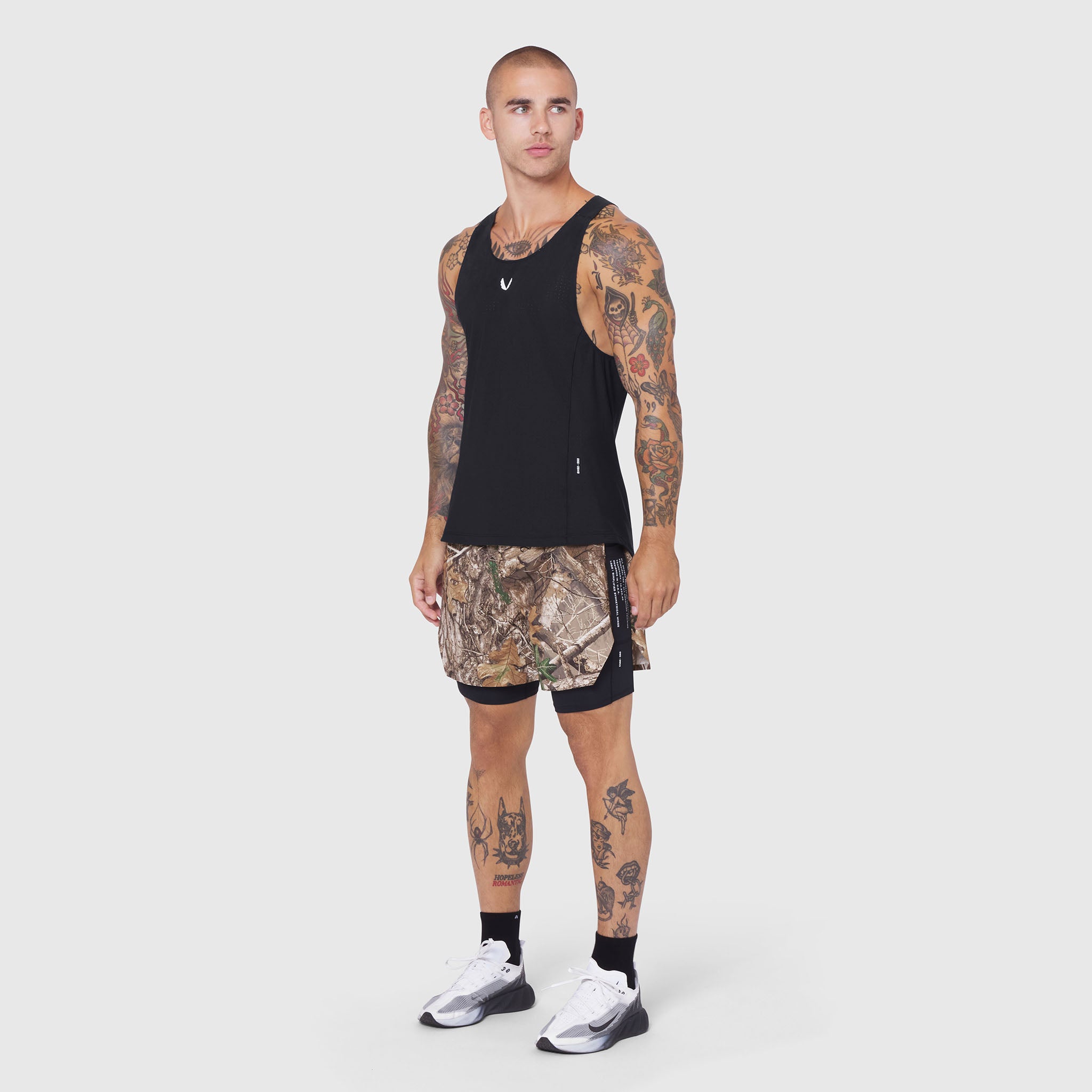 Aerotex Hybrid Liner Short in Realtree Edge camo with black liner, front view on model