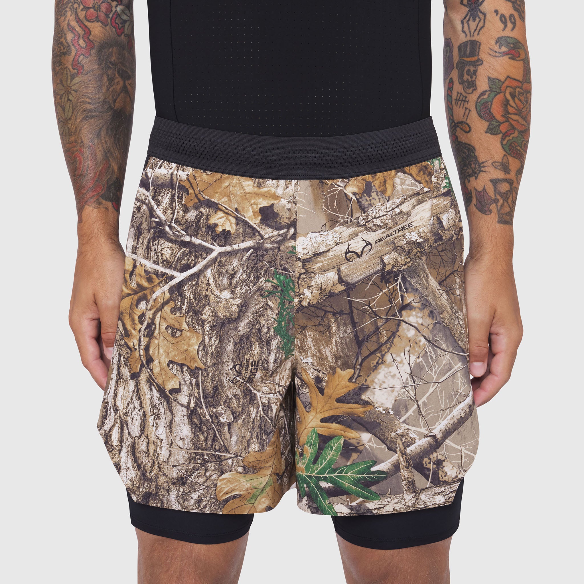 Aerotex Hybrid Liner Short in Realtree Edge camo, front view on model