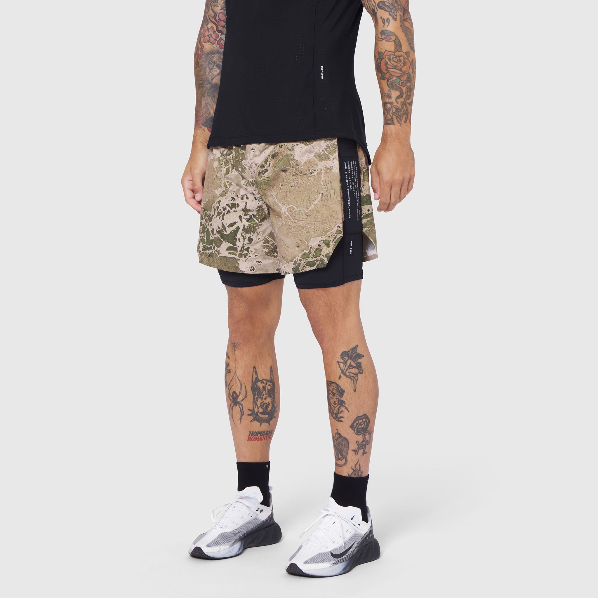Aerotex Hybrid Liner Short in Realtree camo with black liner shorts, worn with white sneakers