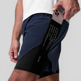 Aerotex™ Hybrid Liner Short in Navy/Black, model holding phone in side pocket