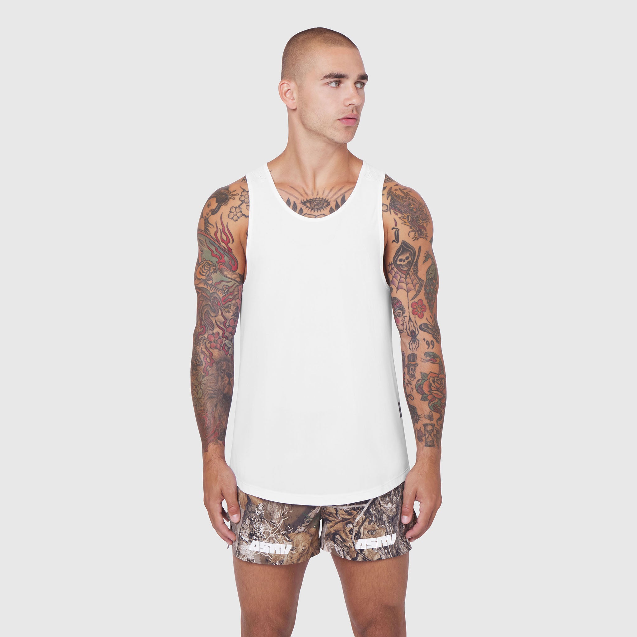 White Laser-Vent™ Tank Top worn by model with full-sleeve tattoos, front view