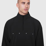 Aerotex Quarter-Zip Jacket in black worn by male model, front view