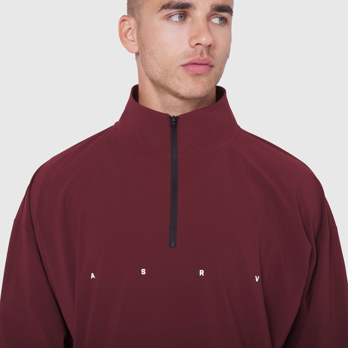 Aerotex Quarter-Zip Jacket in crimson, modeled on male wearing half-zip pullover