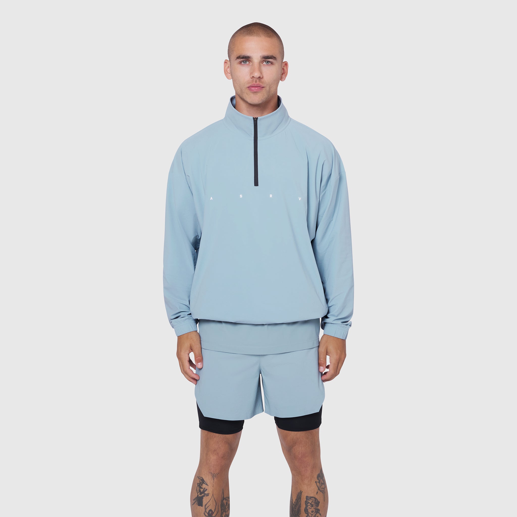 Aerotex Quarter-Zip Jacket in light sky, worn by model with matching shorts, front view