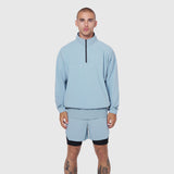 Aerotex Quarter-Zip Jacket in light sky, worn by model with matching shorts, front view