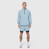 Aerotex Quarter-Zip Jacket in light sky worn with matching shorts, front view on model