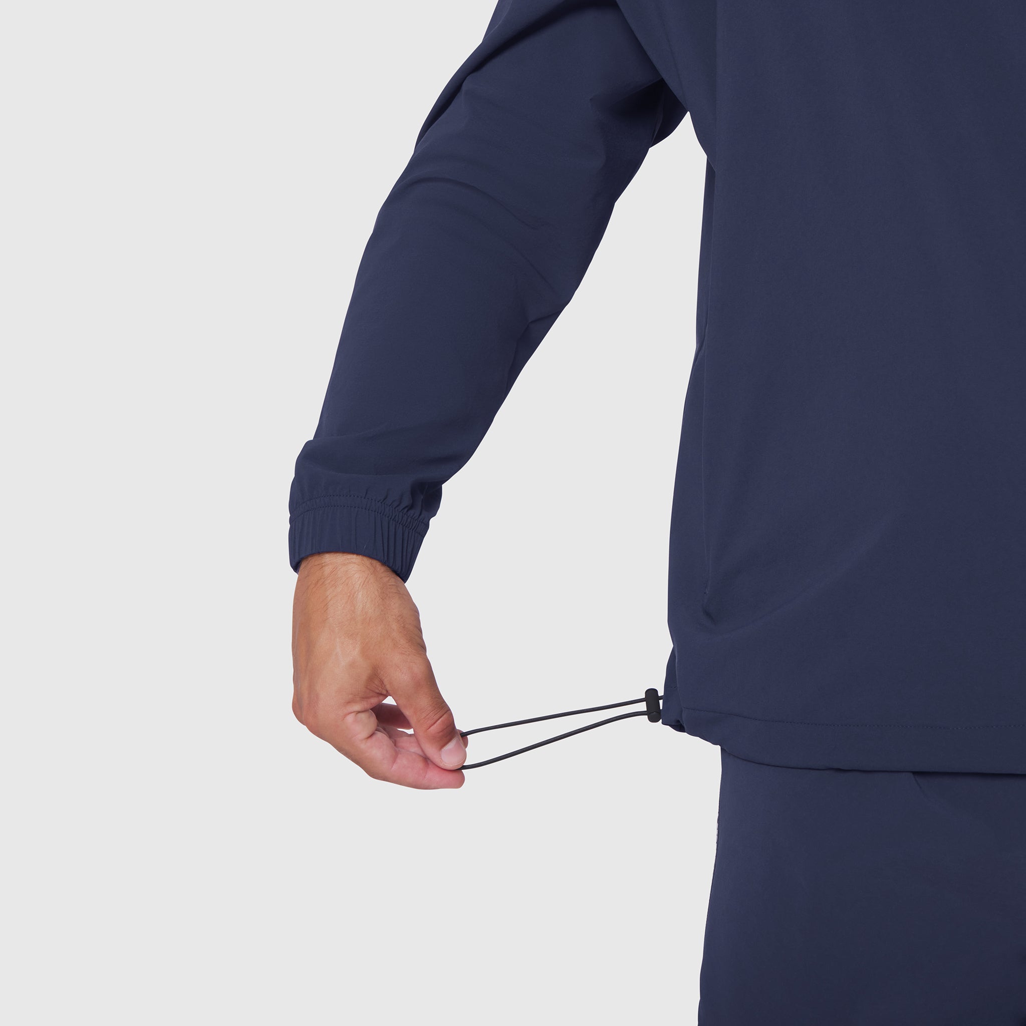 Aerotex Quarter-Zip Jacket in Navy, model wearing jacket showing drawcord detail at wrist